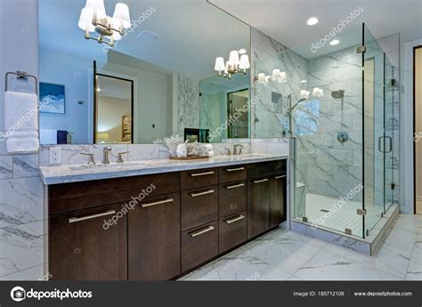 Incredible Master Bathroom With Carrara Marble Tile Surround Stock