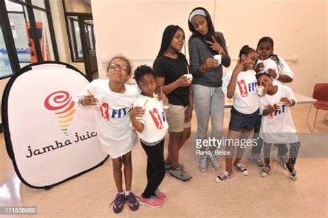 Swin Cash Of The Chicago Sky Poses For Picture With Participants Of A