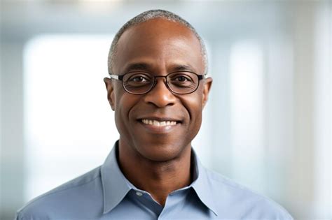 Premium Ai Image A Man With Glasses And A Blue Shirt