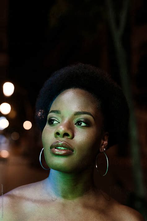 Portrait Of Beautiful Woman With Afro Hair In The Street At Night By