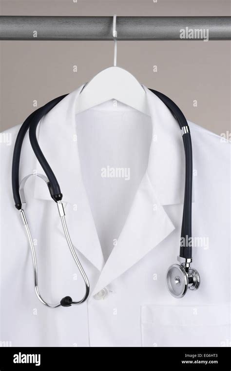 Closeup Of A Doctors Lab Coat And Stethoscope On Hanger Against A