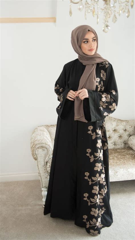 A Beautiful Classic Black Abaya With Contrasting Gold Floral Embroidery The Back Of The Abaya