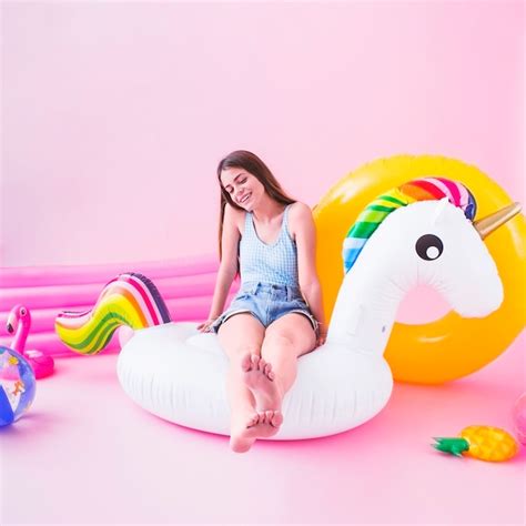 Free Photo Woman On Inflatable Unicorn