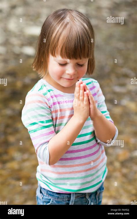 Cute Little Girl Praying Over Textured Background Stock Photo Alamy