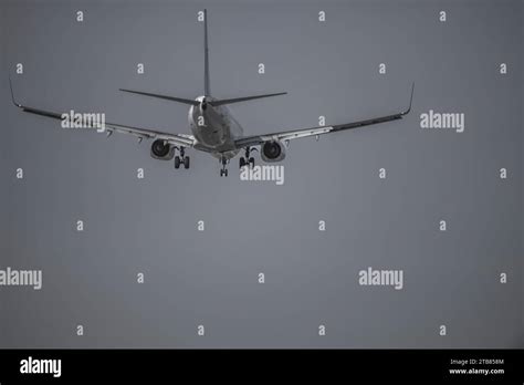 Tail Of A Commercial Airplane Descending To Land Stock Photo Alamy
