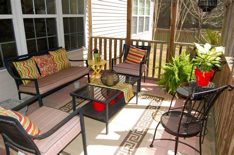 As courtyard patios are often on the small side, it pays to approach them as you would a room in your home, looking at flooring, paint colors and seating to tidy furniture can also help to keep the space feeling light. like the burst of color and rug idea on the porch | Enclosed porch decorating, Screened in porch ...