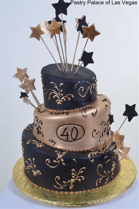 a three tiered cake with gold stars on top and the number forty written
