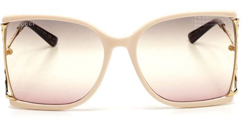 gucci oversized logo sunglasses in white lyst