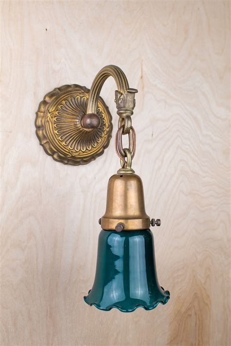 All the mouille hallmarks are here: Hanging Glass Shaded Wall Sconce | Wall Lights ...