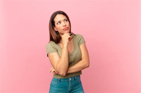 Premium Photo Young Hispanic Woman Thinking Feeling Doubtful And Confused