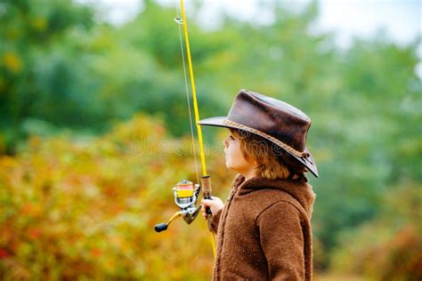 Little Boy Fishing On A Lake Autumn Kids Portrait Stock Image Image