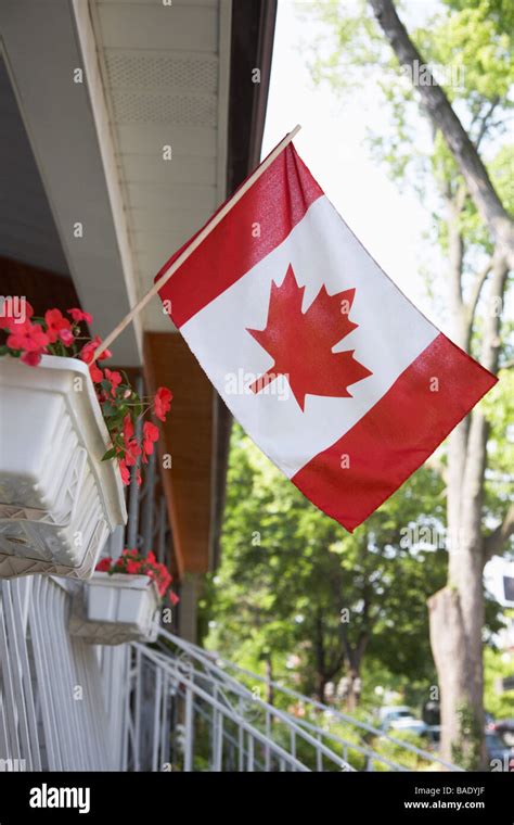 Canadian Flag Flying From Porch Stock Photo Alamy