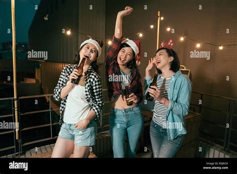 Young Girls Dancing Dark Night Christmas Party Outdoor Cheerful Ladies With Alcohols Beers