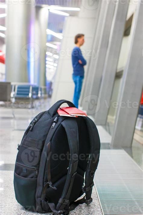 Closeup Passports And Boarding Pass On Backpack At Airport