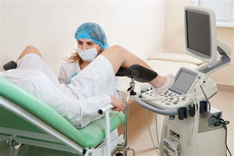 Gynaecologist Examining A Patient Sitting On Gynecological Chair Stock Image Image Of