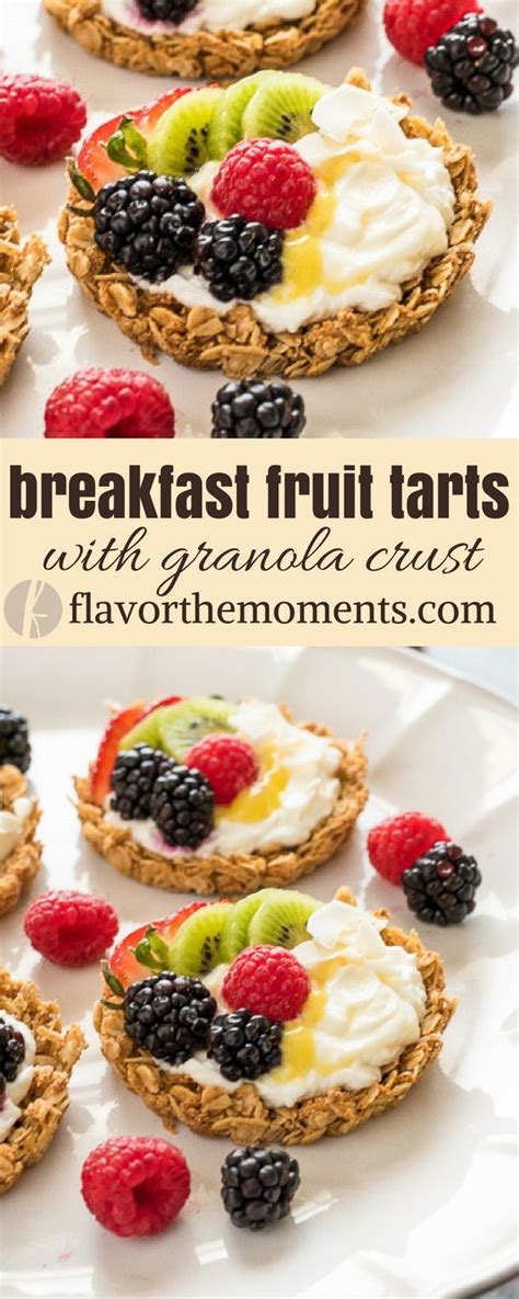 Breakfast Fruit Tarts With Granola Cheese And Fresh Berries On A White