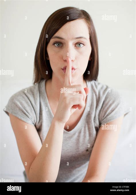 Portrait Of Secretive Young Woman Stock Photo Alamy