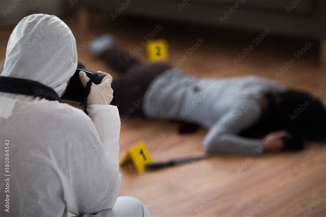Criminalist Photographing Dead Body At Crime Scene Stock Photo Adobe