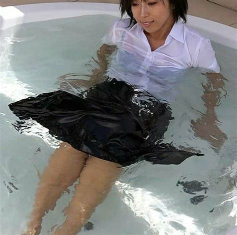 Woman In Black Dress In Hot Tub