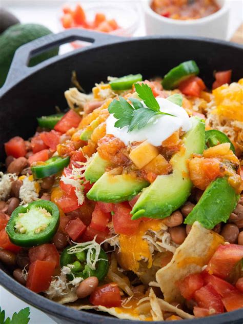 Finally, add the rest of your toppings. Shredded Chicken Skillet Nachos | Create Kids Club