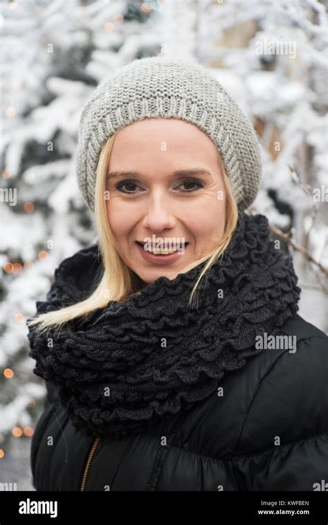 Outdoor Winter Portrait Of A Young Blonde Woman Out In The Snow Stock