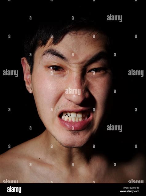 Obverse Portrait Of The Asian Man Aggression Rage Emotions Stock