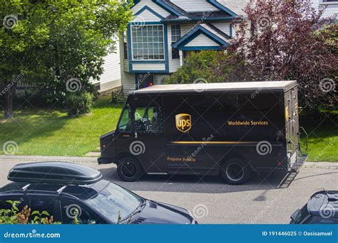 Ups Delivery Truck Parked By The Side Of The Road In Front Of