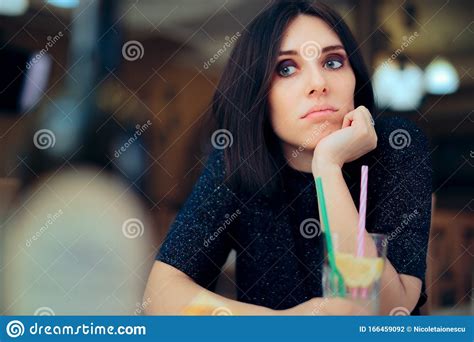 Bored Woman Having A Lemonade At A Party Stock Photo Image Of Anxiety