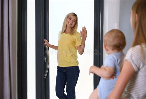 Mother Leaving Her Baby With Teen Nanny Stock Image Image Of