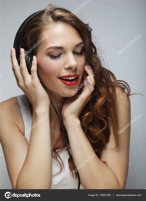 Young Woman With Headphones Listening Music — Stock Photo © Kanareva