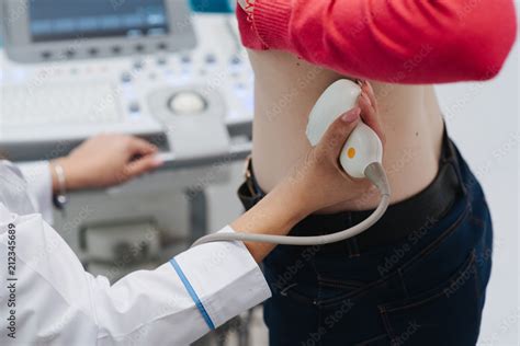 Renal Ultrasound Examination Of Kidneys Hospital Doctor Examines A