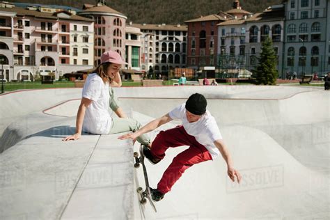 Young Man Doing Skateboarding Trick Outdoor Stock Photo Dissolve