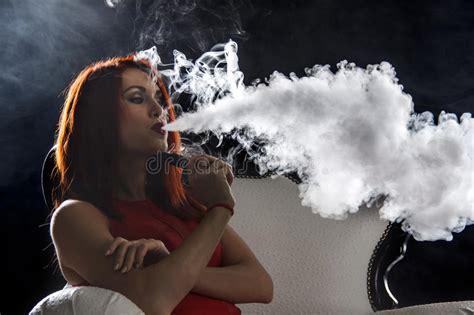 Woman Smoking Electronic Cigarette Vape Mod Concept Stock