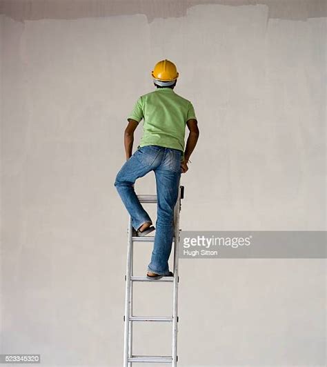 Construction Worker Climbing Ladder Photos And Premium High Res
