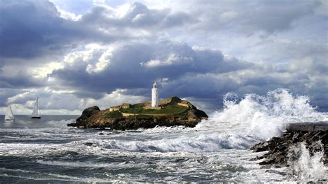 Lighthouse In Stormy Sea Hd Wallpaper Background Image 1920x1080