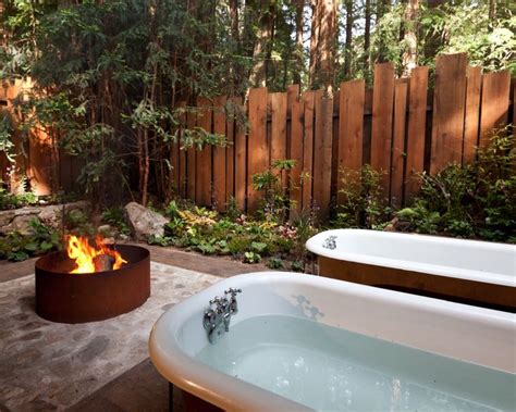 A Bath Tub Sitting Next To A Fire Pit