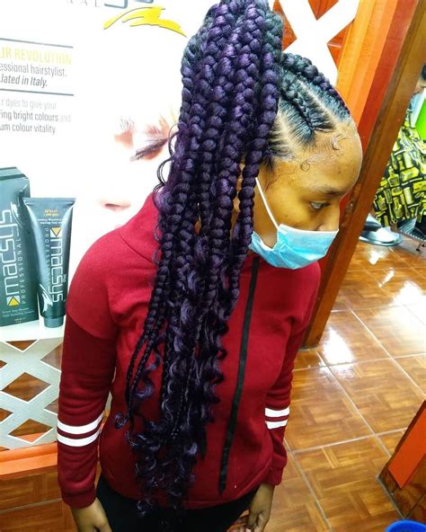 How will dark hair look with purple highlights when it is not bleached first? Thick Braided Hairstyle With Purple Highlights