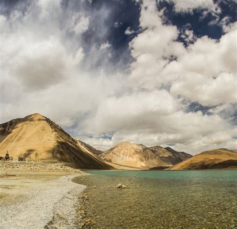 Turquoise Lake In The Himalayas Tibet Mountains With Clouds And Blue