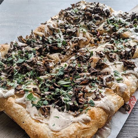 Funghi Pizza with wild mushroom, truffle cream, parsley, & olive oil ...