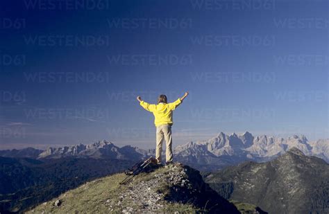 Austria Salzburger Land Man Standing On Top Of Mountain With Arms Up