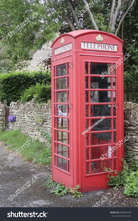 Classic English Red Telephone Booth Front Stock Photo 659009158