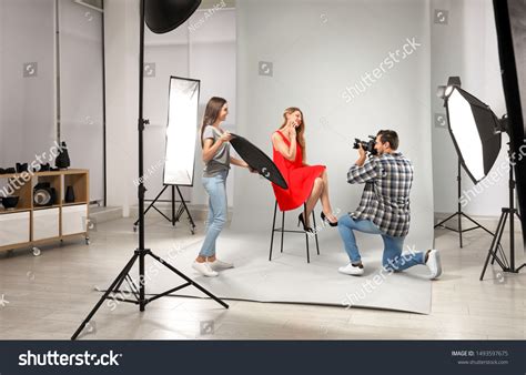 Professional Photographer Assistant Taking Picture Young Stock Photo