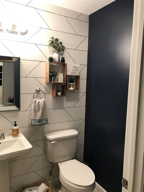 Half Bath With Accent Wall And Navy Paint Bathroom