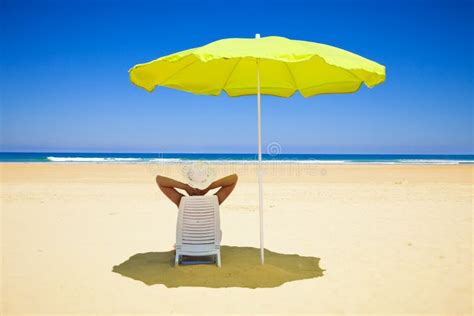 Woman Resting Under A Beach Umbrella Royalty Free Stock Images Image