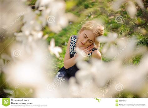 Portrait Of Young Beautiful Model Woman Posing In The Garden With