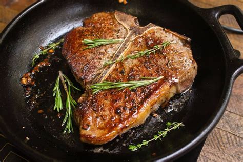 Porterhouse Steak In A Cast Iron Pan After Being Seared And Oven Baked