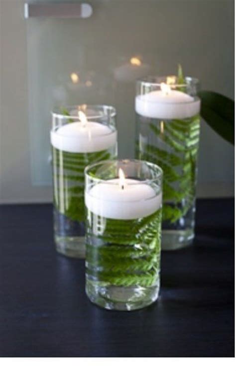 Pin By Kristi Adams On Wedding Table Floating Candle Centerpieces Glass Cylinder Vases