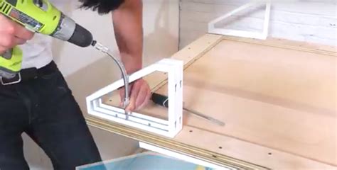 She Is Attaching Ikea Shelf Brackets Into A Large Piece Of Wood To Make