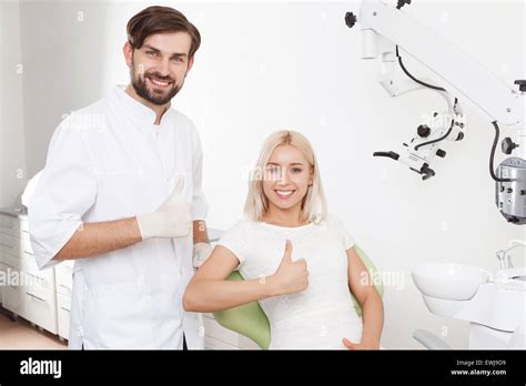Portrait Of Smiling Dentist And Patient Stock Photo Alamy
