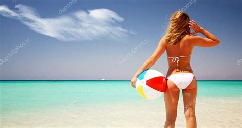 Tanned Woman S Back Relaxing On The Sandy Beach Stock Photo